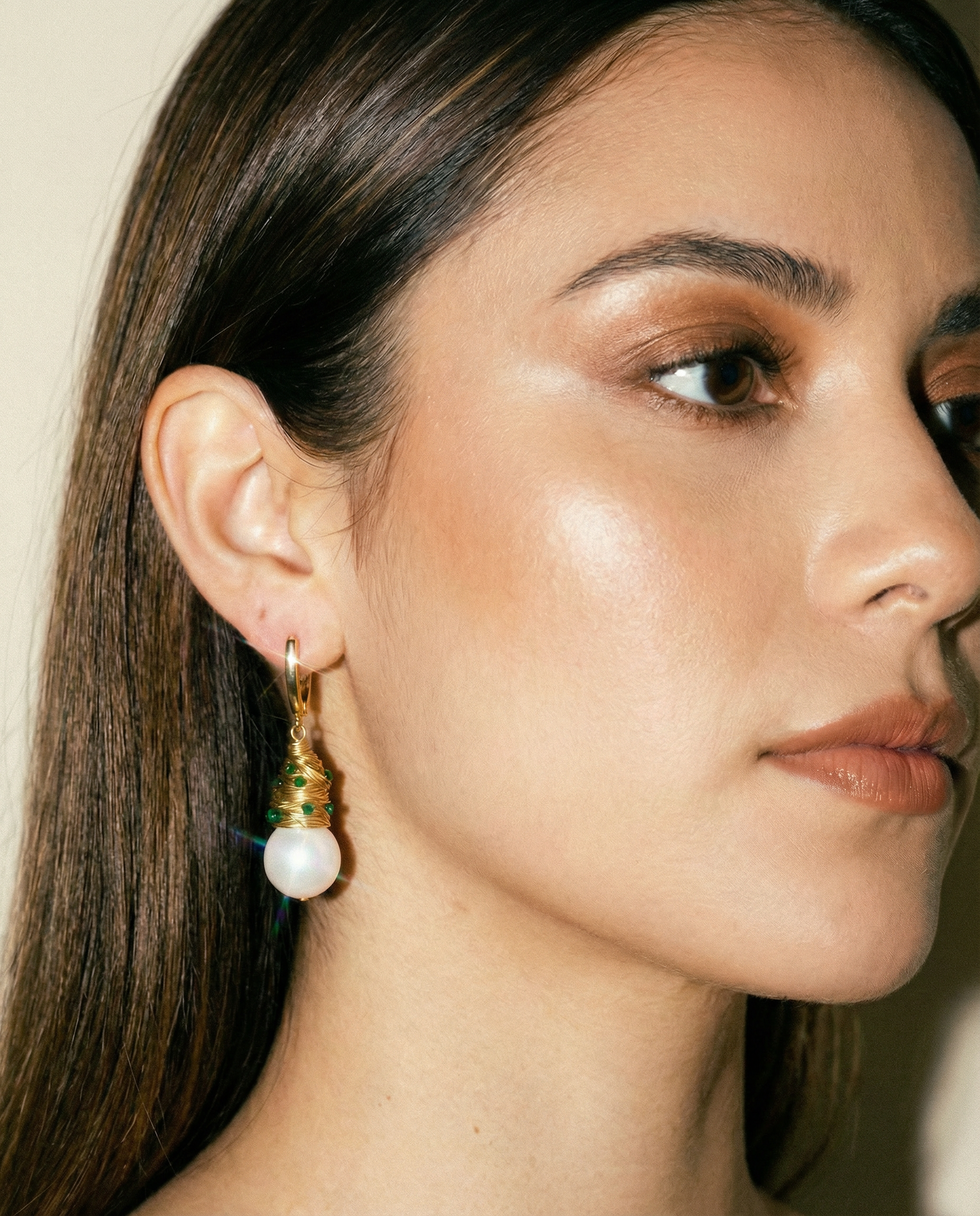Wired Golden Drop Earrings with Emerald Stones