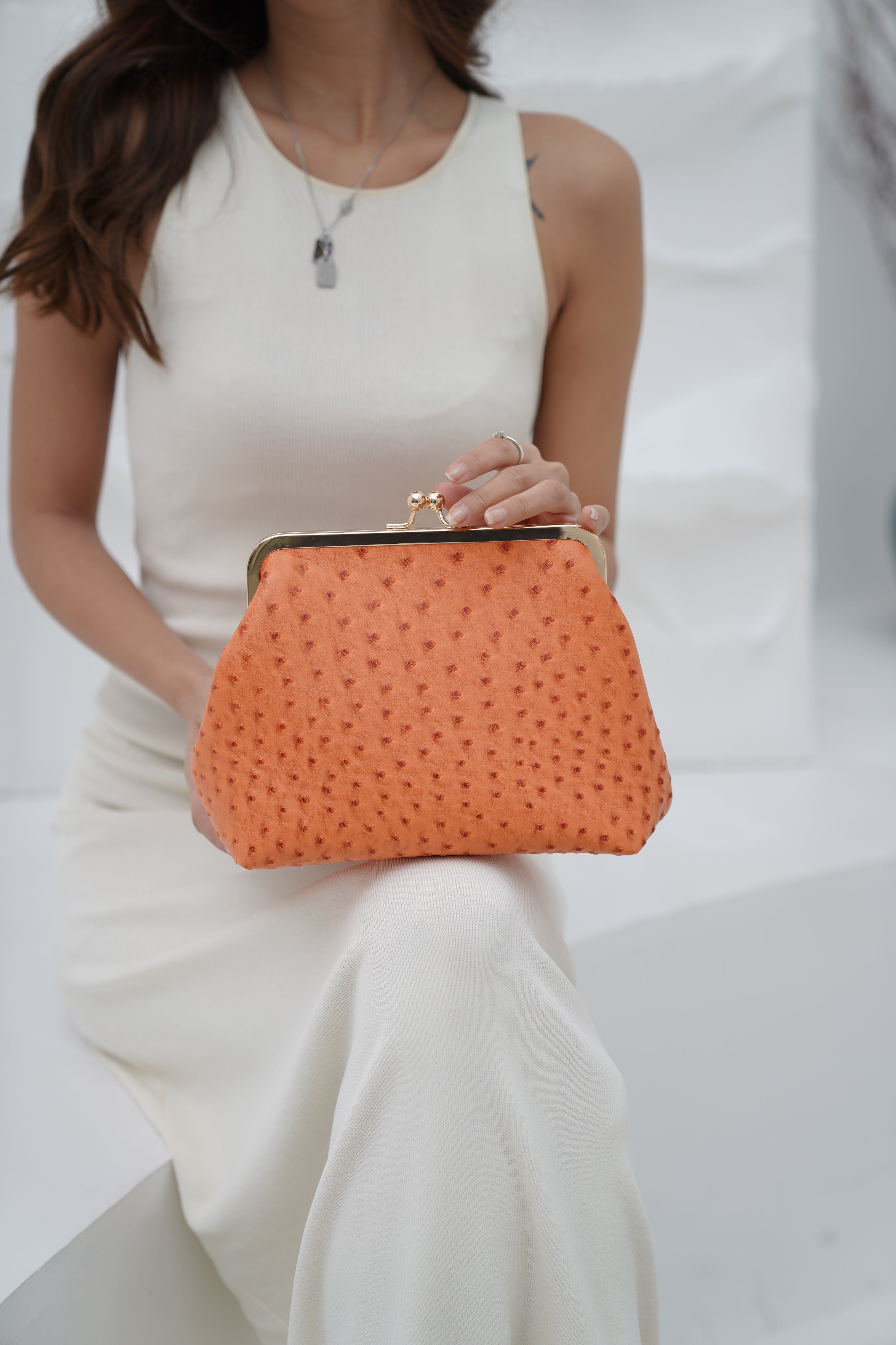 Metal Lock & Kiss Clutch in Orange