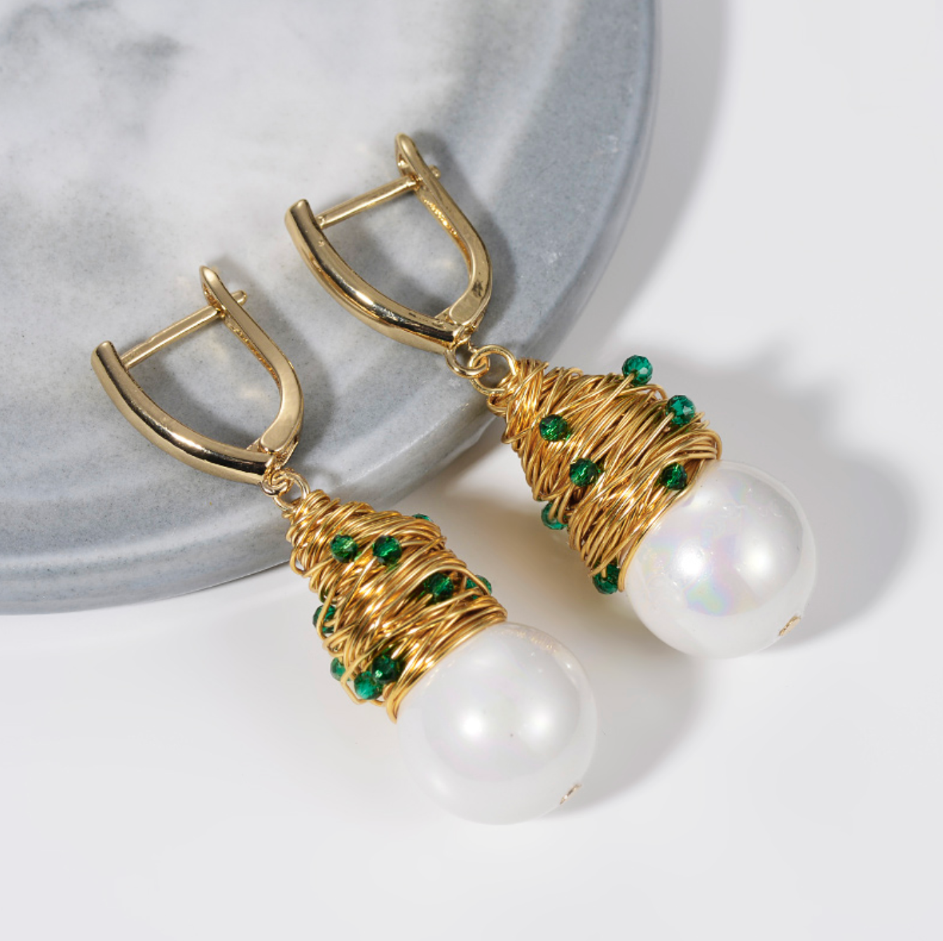 Wired Golden Drop Earrings with Emerald Stones